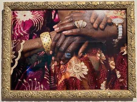 Hands covering each other with jewellery.
